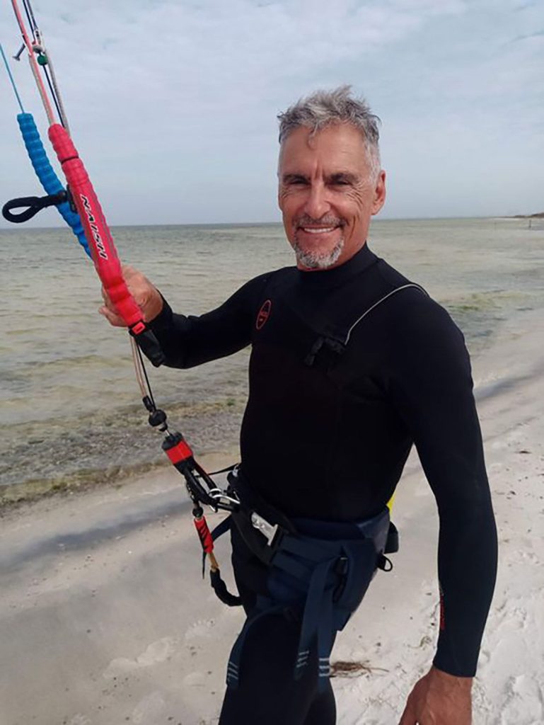 Cliff Simon smiling with kiteboarding gear
